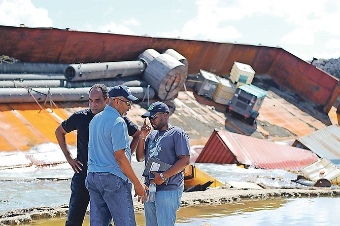 A government delegation during a visit to the site of an abandoned barge in Long Island earlier this year. Photo: Carlyle Sands/BIS

