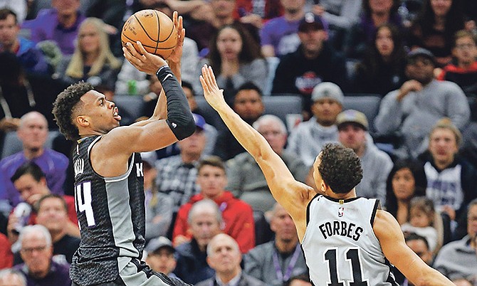 Sacramento Kings guard Buddy Hieldshoots over Spurs’ Bryn Forbes (11) during the second half on Saturday. The Spurs won 108-99.

(AP Photo/Steve Yeater)

 