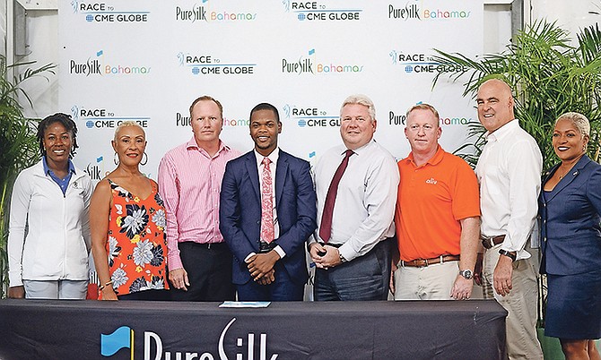 SHOWN (l-r) at the press conference to open the Bahamas LPGA Classic are Georgette Rolle, Sharon Cleare, Travis Robinson, Robbie Leming, Kevin Darling, Alan Bates, Jeff Raedle and Eldece Clarke.
                                                                                                                                                                                                                                                                 Photo: Shawn Hanna/Tribune Staff