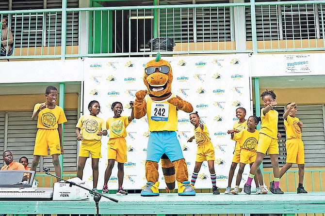 Iggy the Carifta mascot was welcomed by students at Yellow Elder Primary School as the countdown continues to this year’s games.
Photo: Terrel W. Carey/Tribune Staff