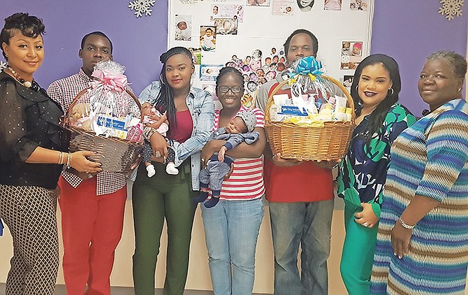 Pictured from left: Nestaéa Sealy, Johnson and Johnson brand manager; Eugene Williamson; She’mon Williamson, holding baby Aria; LaShawn Rolle-Bethel, holding baby Damian Jr; Damian Bethel; Krista Nairn, Lowe’s marketing manager, and Patricia Brown, Doctors Hospital Maternity Department coordinator.

 