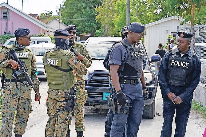 THE ROYAL Bahamas Police and Defence Force conduct an operation in the areas of Peach Street
and Deveaux Street, where firearms and drugs were found. Photos: Terrel W. Carey/Tribune Staff