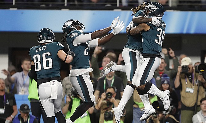Philadelphia Eagles' Corey Clement, right, celebrates his touchdown catch during the second half. (AP Photo/Jeff Roberson)