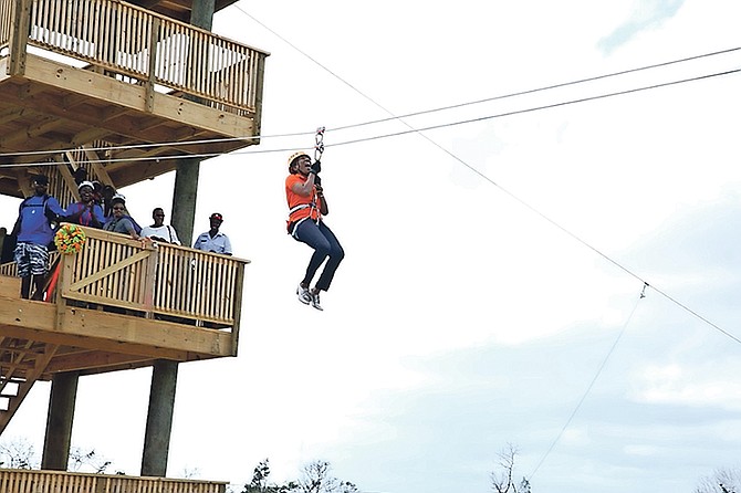 Patricia Minnis, wife of Prime Minister Dr Hubert Minnis, was one of the first brave persons to try out the zip line at Pirate’s Cove Zip Line & Water Park during an opening ceremony on Saturday, February 3. Mrs Minnis successfully zipped on the 30ft line and she set the stage for others to try. Deputy Prime Minister Peter Turnquest followed, choosing to take the 50ft line where he waved to the crowd as he zipped by. Photos: Lisa Davis/BIS

 