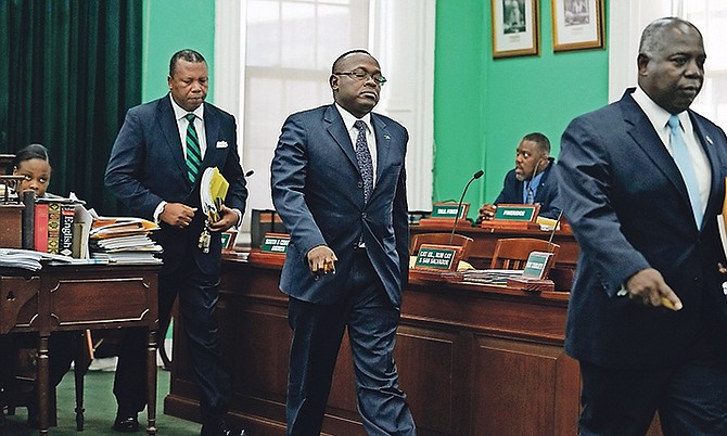 South Andros and Mangrove Cay MP Picewell Forbes, Exuma and Ragged Island MP Chester Cooper and PLP Leader Philip 'Brave' Davis leave the House of Assembly. Photo: Terrel W Carey/Tribune staff
