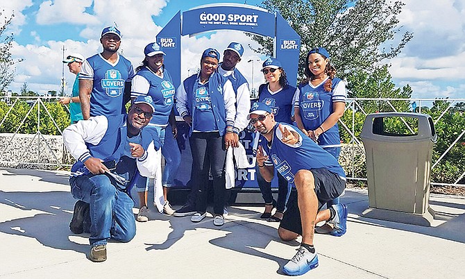 SPORTS reporter Renaldo Dorsett (back left) and several well-deserved winners earned the opportunity to enjoy the Bud Light powered amenities at Dolphins/ Broncos December 3.