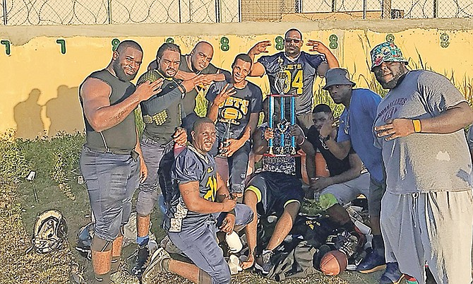 Nassau Jets celebrate with their championship trophy.