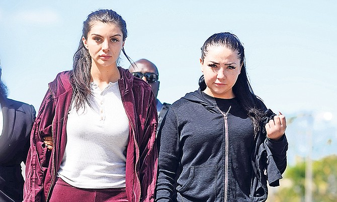 Sydney Mills and Natasha Stolove outside court yesterday where they faced fraud charges. Photos: Shawn Hanna/Tribune Staff