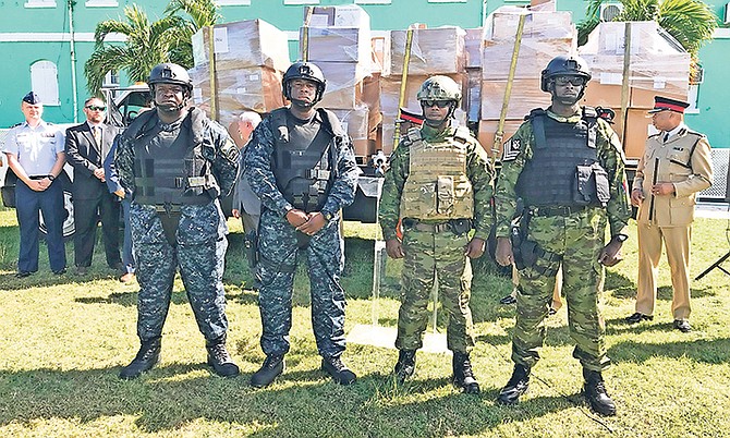 Officers dressed in vests presented by the US Embassy along with other equipment for DEU, Strike Force and Marine Support unit. Photo: Terrel W. Carey/Tribune Staff
