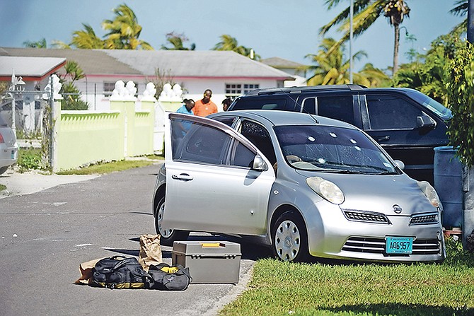 Bullet holes in a car at the scene of a police-involved shooting in Carmichael. Photo: Shawn Hanna/Tribune Staff

 