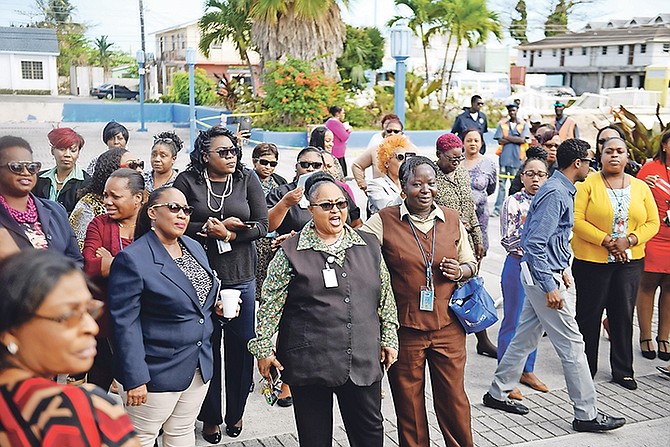 Angry employees of the National Insurance Board outside the Baillou Hill Road headquarters yesterday. Photo: Shawn Hanna/Tribune Staff

 