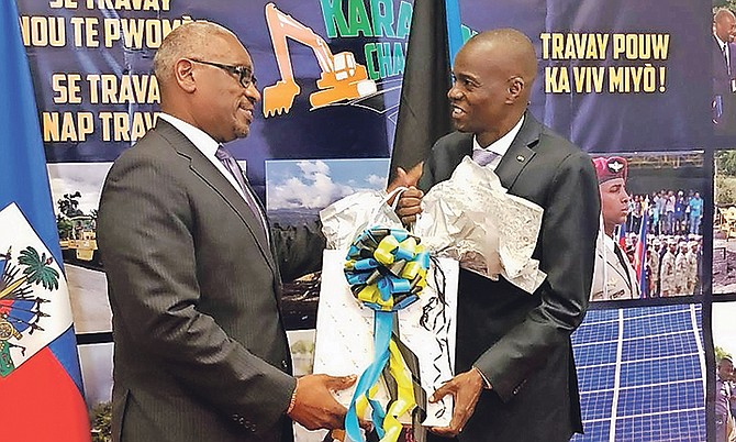 Prime Minister Dr Hubert Minnis, left, presents a gift to Haitian President Jovenel Moise in Haiti yesterday. Dr Minnis and a delegation of Cabinet ministers are in Haiti for CARICOM meetings.

Photo: Yontalay Bowe/OPM Media Services

 