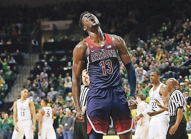 Arizona’s DeAndre Ayton celebrates during the second half against Oregon in an NCAA college basketball game on Saturday in Eugene, Oregon. Oregon won 98-93 in overtime.

(AP Photos/Chris Pietsch)

 