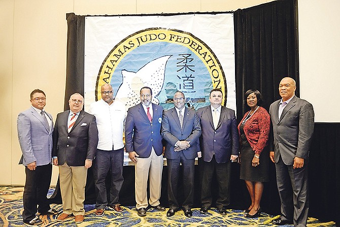 The Bahamas Judo Federation hosted a press conference yesterday at the Atlantis Resort Imperial Ballroom to speak about upcoming events. Shown (l-r) are Mike Tamura, President of Judo Canada, Jose Rodriguez, IJF Director of Development, Rommel Knowles, President of the Bahamas Olympic Committee, D’Arcy Rahming, President of Bahamas Judo Federation, Michael Pintard, Minister of Youth, Sports and Culture, Daniel Lascau, IJF Presidential Office, Virginia Kelly, Director of Sports Tourism and Wellington Miller, LOC Chairman.

Photo: Shawn Hanna/Tribune Staff

 