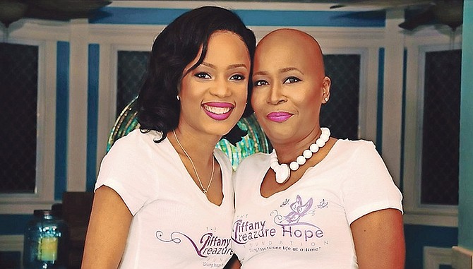 Cancer survivor Toni Lewis (right) with Felicia Archer of Fresh Fire Outreach Ministries.