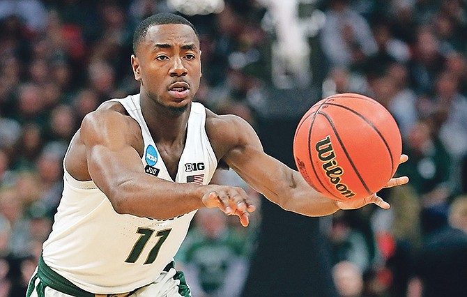 Michigan State guard Lourawls Nairn Jr (11) passes during a first round game against Bucknell in the NCAA college basketball tournament on March 16 in Detroit. (AP Photo/Carlos Osorio)
