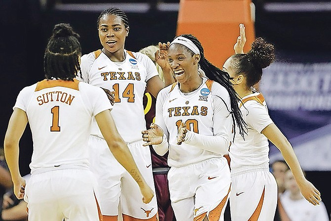 Texas guard Lashann Higgs (10) celebrates a score with teammates Alecia Sutton (1), Olamide Aborowa (14) and Brooke McCarty (11) during a second-round game in the NCAA women’s college basketball tournament against Arizona State, Monday, March 19, 2018, in Austin, Texas. Texas won 85-65. (AP Photo/Eric Gay)