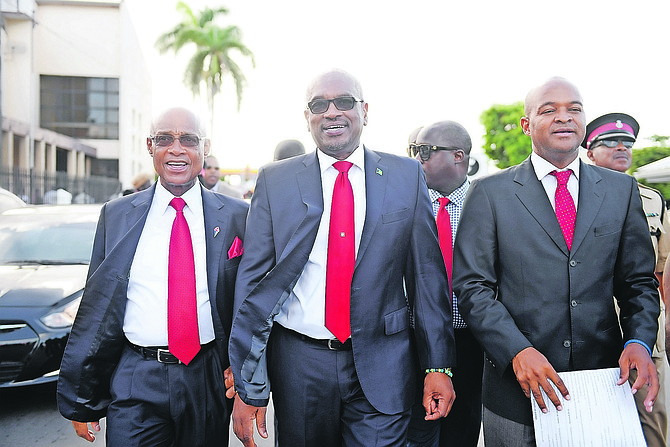 Centreville MP Reece Chipman (right) with Prime Minister Dr Hubert Minnis (centre).