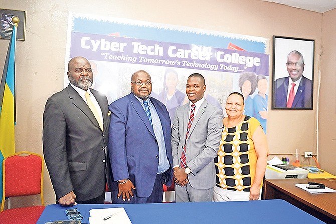 From left: Lionel Evans, executive director at Cyber Tech Career College; Philip Curry, president/director at Cyber Tech Career College; Travis Robinson, MP for Bain and Grants Town and Maria Minnis, chairman for Bain and Grants Town Association. Photo: Shawn Hanna/Tribune Staff

 
