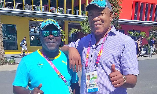 Chef de Mission Roy Colebrooke and immediate past BOC president Wellington Miller give the thumbs up to Team Bahamas at the Games Village.
