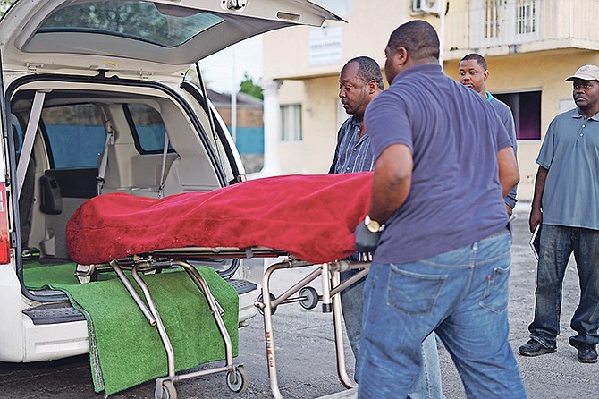 POLICE remove the body of a man who was shot and killed off Moore Avenue early on Tuesday morning. This came hours after another shooting death at nearby Homestead Street. 