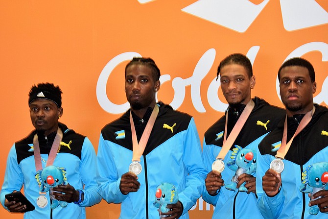 The men’s 4x400 relay team with their silver medals.