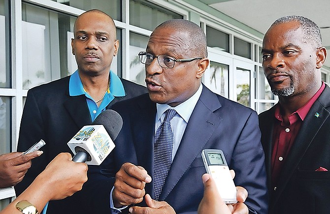 Minister of Youth, Sports and Culture Michael Pintard (centre); Rev Frederick McAlpine (left), member of Parliament for Pineridge; and Parliamentary Secretary in the Ministry of Works and member of Parliament for Central Grand Bahama Iram Lewis speak to the media on Monday as cheques were issued to homeowners for roof repair in Grand Bahama. Photo: Lisa Davis/BIS

 

 