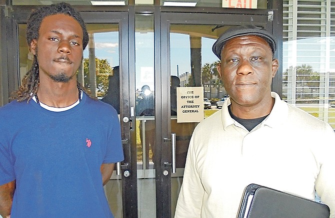 THE Rev Glenroy Bethel (right), founder of Families for Justice, and Jarado Mark, 26, outside the Office of the Attorney General in Grand Bahama. Photo: Denise Maycock/Tribune Staff
