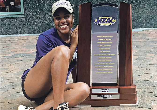 Danielle Thompson with the Morgan State team trophy.
