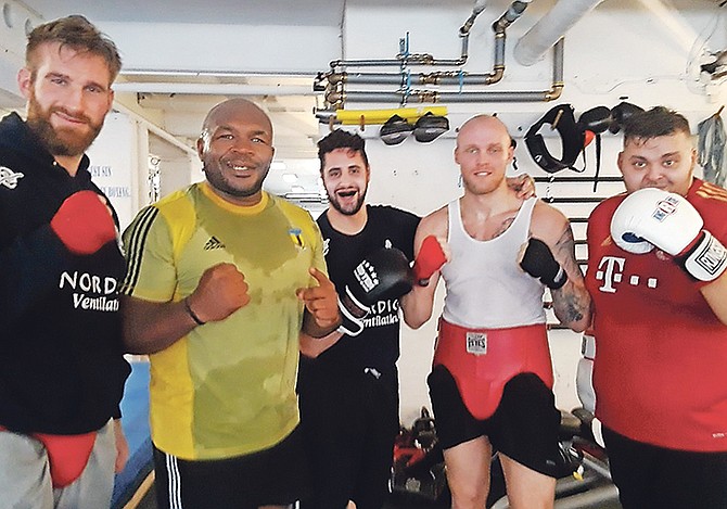 Sherman Williams, second from left, is flanked by some of his sparring partners.