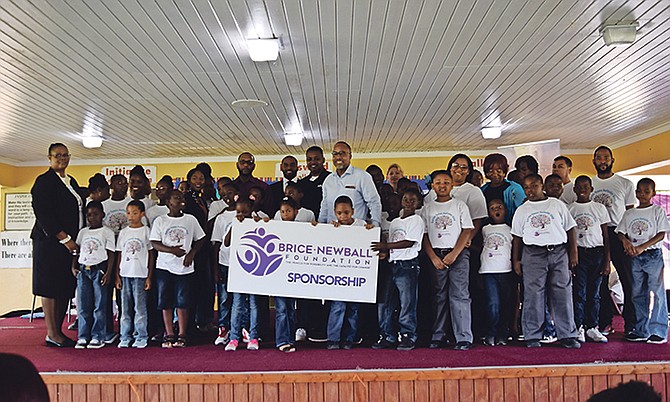 Students and teachers of the autism unit at Garvin Tynes Primary School pose with officials from the Brice-Newball Foundation and Jet Blue.