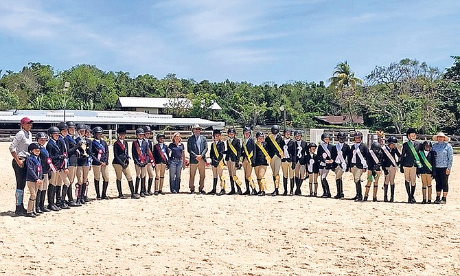 PROUD riders receive their ribbons - (l-r): Mrs Erika Adderley-Coello, coach; Lyford Cay School Team riders; Queens College Team riders; Mrs Elizabeth Williams, Vice-President of Equestrian Bahamas;
Mr Scott Hofstetter, Show Judge; St Andrew’s School Team riders; Lucaya International School Team riders; Windsor Prep Team riders; Tambearly School Team riders; Independent/Home-Schooled
Team riders; Mrs Kimberly Johnson, coach.