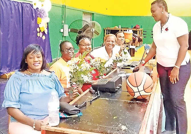 NPWBA president Mynez Cargill-Sherman makes presentations to the mothers, who serve as statisticians at the table during their NPWBA games at the DW Davis Gymnasium.