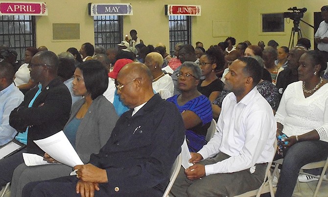 Residents attend town meeting hosted by the Minister of the Environment Romauld Ferreira on Thursday evening at the Church of the Good Shepherd in Lewis Yard/Pinder's Point.