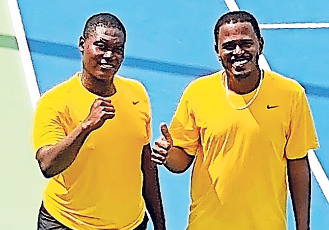 Philip Major Jr, left, and Marvin Rolle pose together after their doubles victory.