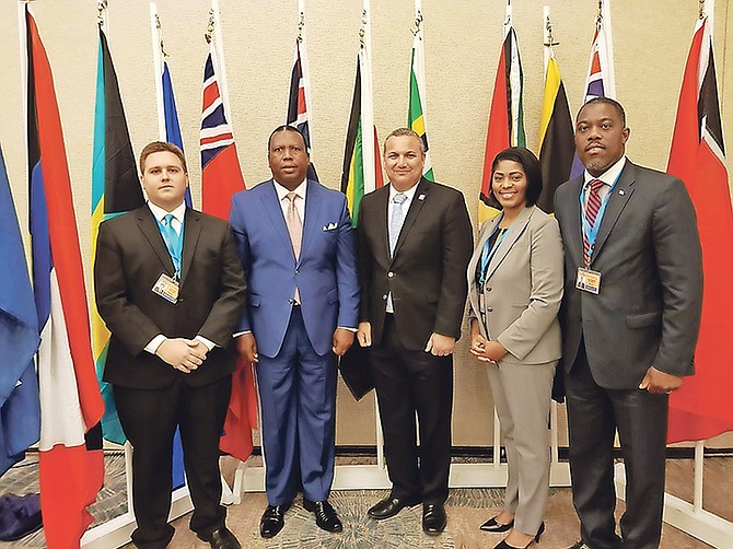 From left, Central and South Abaco MP James Albury, South Andros MP Picewell Forbes, pictured with an official, West Grand Bahama and Bimini MP Pakesia Parker-Edgecombe and Tall Pines MP Don Saunders were absent for the VAT vote on Monday due to the obligations in the Cayman Islands for a Commonwealth Parliamentary Association forum.

 