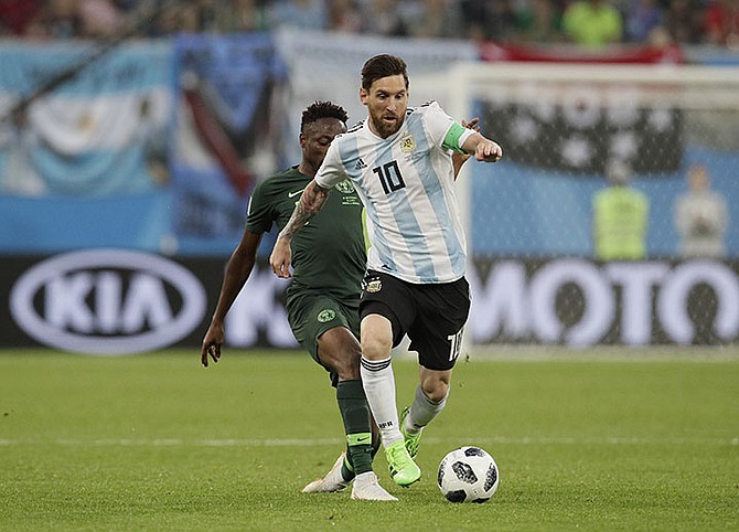 Argentina's Lionel Messi, front competes for the ball during the group D match between Argentina and Nigeria at the 2018 soccer World Cup in the St. Petersburg Stadium in St. Petersburg, Russia. (AP)