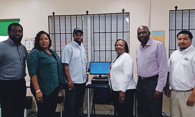 Bahamas Striping donated five new HP desktop computers to Programme SURE on Monday. From left, computer teacher Dion Johnson; Fredericka Sturrup, senior vice president of HR and training; BSGC’s president Atario Mitchell; Principal Angela Hunt; Dr Allen Albury, BSGC’s managing director and United Data Technologies Ltd president Quincy Rolle. Photo: Precision Media

 