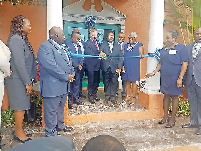 GIBC Digital officially opened its offices on Grand Bahama yesterday. Minister of Finance Peter Turnquest, GIBC CEO Greg Wood, and other officials were on hand for the ribbon cutting ceremony.

Photo: Denise Maycock

 