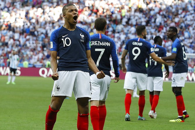 France's Kylian Mbappe celebrates after scoring his side's third goal during the round of 16 match between France and Argentina, at the 2018 soccer World Cup at the Kazan Arena in Kazan, Russia, Saturday. (AP Photo/David Vincent)

