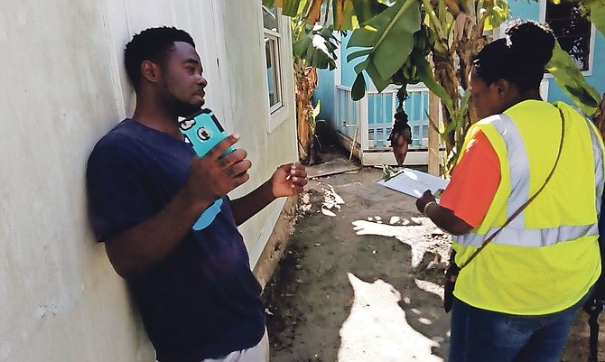 Residents of shanty towns in Abaco speaking to government representatives visiting the area.