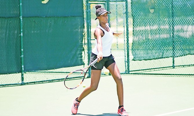 Abigail Simms, of the Bahamas, in action against American Victoria Lushnikov, of the US. She won 6-4, 6-2 to advance out of the first round yesterday at the National Tennis Centre.

Photo: Shawn Hanna/Tribune Staff

 