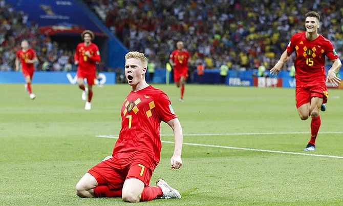 Belgium's Kevin De Bruyne, centre, celebrates after scoring his side's second goal during the quarterfinal match between Brazil and Belgium. (AP)