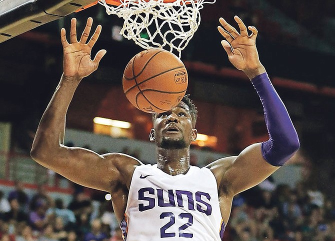 Phoenix Suns’ Deandre Ayton dunks against the Dallas Mavericks during the second half of an NBA summer league game in Las Vegas.

(AP Photo/John Locher)

 