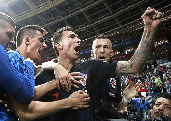 Croatia's Mario Mandzukic celebrates after scoring his side's second goal during the semifinal match between Croatia and England at the 2018 soccer World Cup in the Luzhniki Stadium in Moscow. (AP Photo/Francisco Seco)

