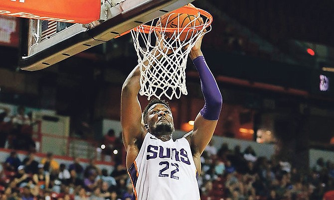 Phoenix Suns’ Deandre Ayton dunks against the Dallas Mavericks during the second half of an NBA summer league basketball game on Friday in Las Vegas.

(AP Photo/John Locher)

 