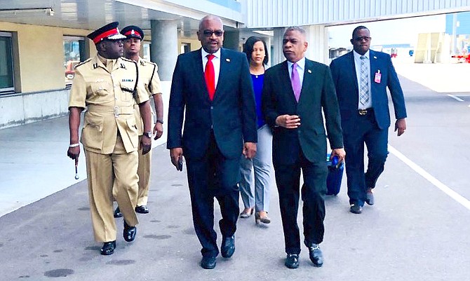 Prime Minister Dr Hubert Minnis, centre, prepares to leave LPIA for New York.  At right is OPM Permanent Secretary Jack Thompson, and, behind, Chief Operating Officer of the Prime Minister’s Delivery Unit Viana Gardiner. (BIS Photo/Yontalay Bowe)