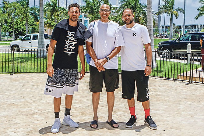 LIKE FATHER LIKE SONS: Bahamian basketball legend Mychal Thompson (centre) with his sons - Mychel “MJ” Thompson and Klay Thompson, of the NBA champions Golden State Warriors at the Jeff Rodgers Summer Basketball Camp yesterday.