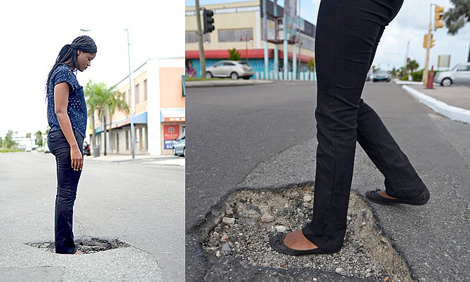 The Tribune's Farrah Johnson stands in a pothole on East Bay Street. Photos: Shawn Hanna/Tribune staff