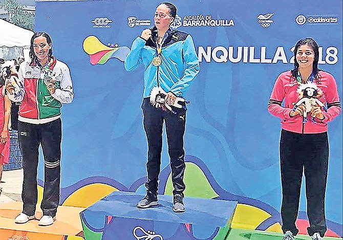JOANNA EVANS, of the Bahamas (centre), on the medal podium last night after she won the gold in her speciality - the 800 metre freestyle - at the 23rd Central American and Caribbean Games in Barranquilla, Colombia.